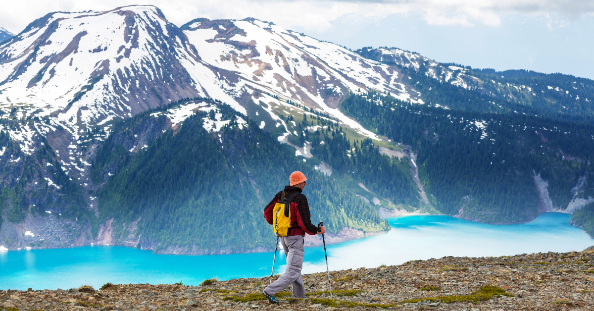 A man hikes through the rocky mountains of Canada.